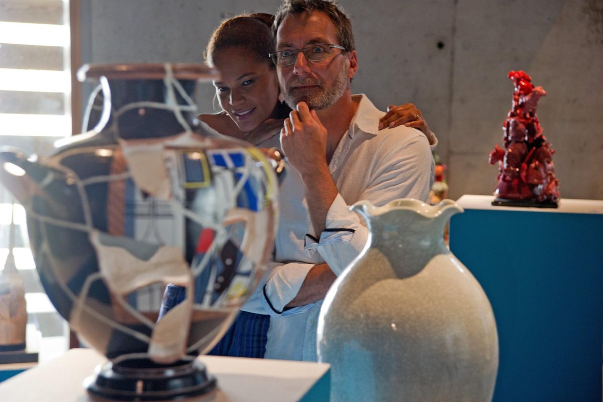 A couple are looking at some of the clay and glass pieces on display at an exhibition at the Canadian Clay and Glass Museum in Waterloo.