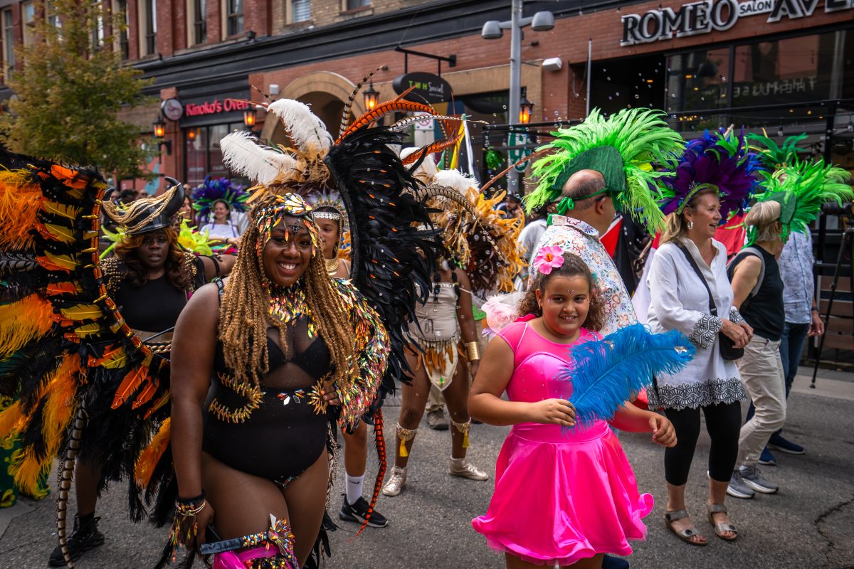 Revellers who were part of the inaugural Caribana Ignite mas parade in downtown Kitchener. All are dressed in very colourful and elaborate costumes.