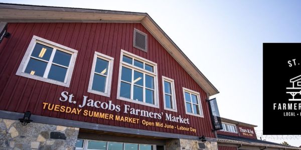 An upward angled view of the entrance to the main red building at the St. Jacobs Farmers' Market
