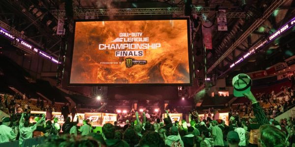 The main auditorium at the Kitchener Memorial Auditorium . You can see the floor and stands are full of Call of Duty fans: the main screen on the jumbotron says Call of Duty League Championship Final.