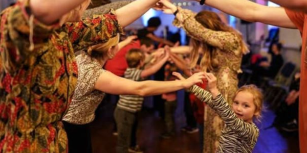 A group of people dancing at a ceili as part of the Irish Real Life Festival in Kitchener.