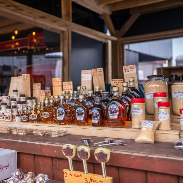 A vendor display of maple syrup and maple syrup products at the St. Jacobs Farmers' Market.