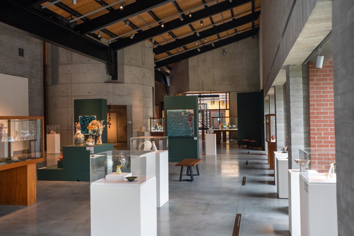 Several covered displays showing glass and ceramic art pieces in the large exhibit hall at the Canadian Clay and Glass Gallery in Waterloo.