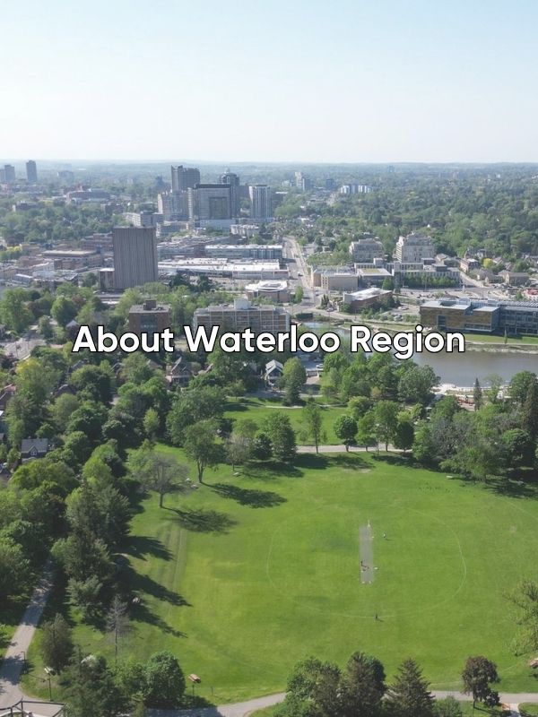 Drone view of the City of Waterloo on a summer's day. You can see the city, Silver Lake, the boardwalks along the lake, and lots of green spaces. The words About Waterloo Region are overlayed onto the image.