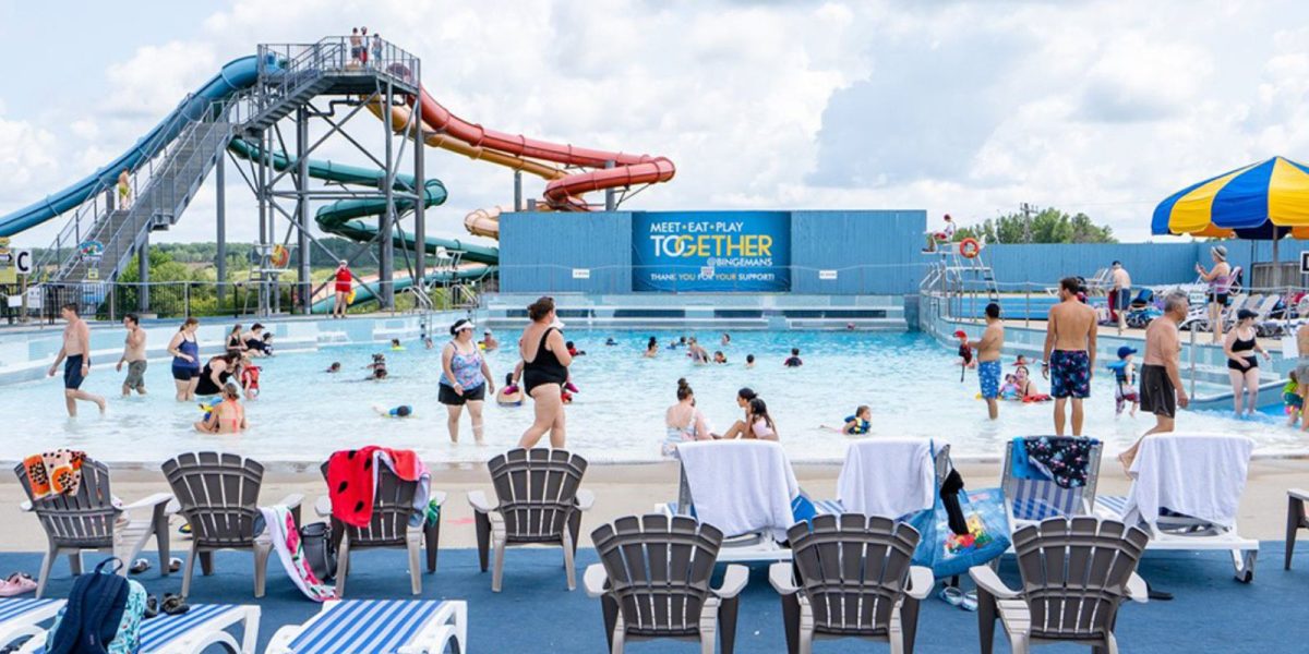 The waterpark area at Bingemans Big Splash in Kitchener. There are several people of all ages in the wave pool.