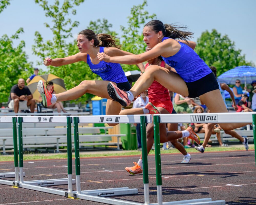 Athletes competing in a hurdles heat at the Waterloo Region Ontario Summer Games.