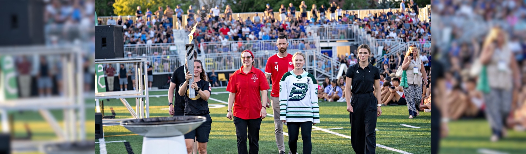 The end of the torch run with the cauldron being lit during the Opening Ceremonies of the Waterloo Region 2026 Ontario Summer Games.