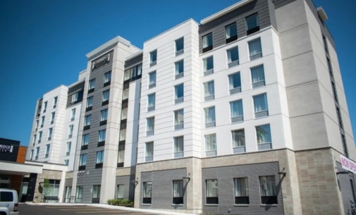 The outside view of the gray multi-storey Staybridge Suites Hotel in St. Jacobs.