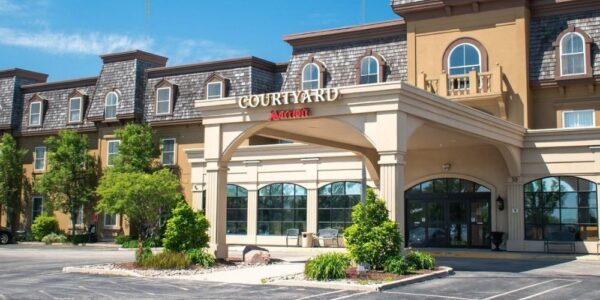 The yellow brick exterior of the Courtyard by Marriott Hotel in Waterloo St. Jacobs.