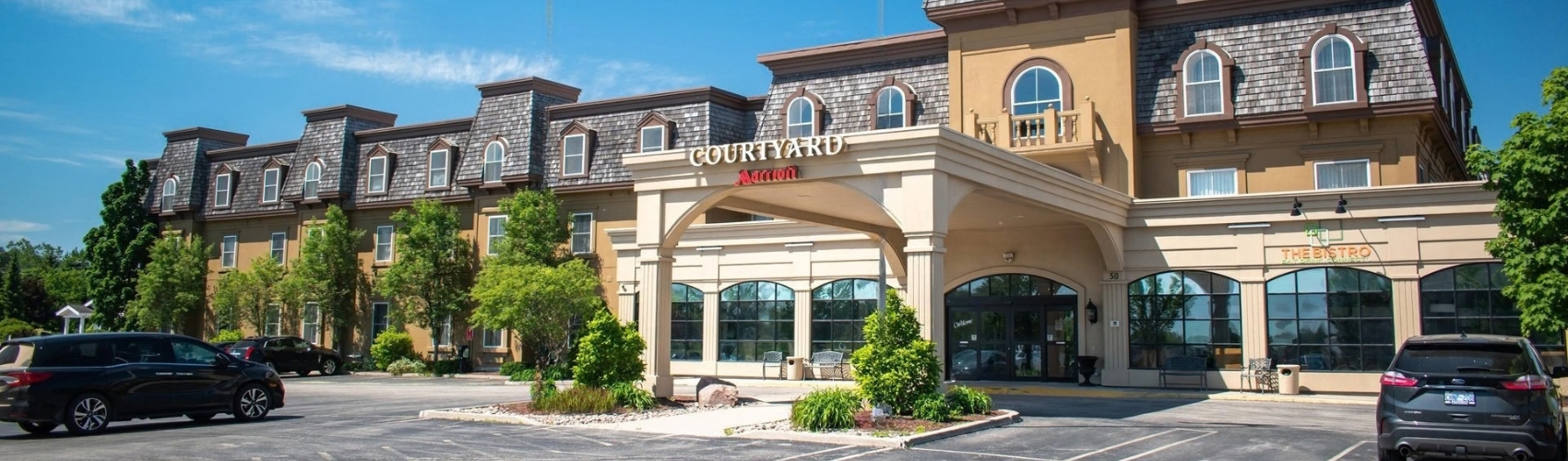 The yellow brick exterior of the Courtyard by Marriott Hotel in Waterloo St. Jacobs.